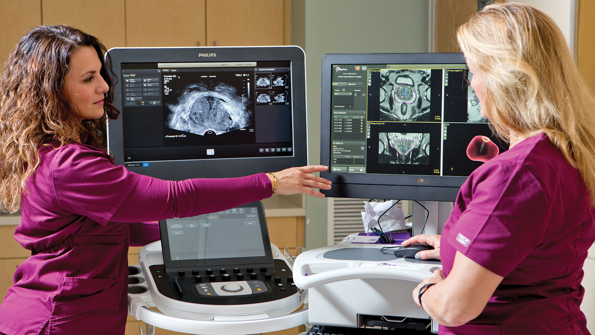 Radiology techs Ana Fraga-Guerrero and Maria Stingone with the UroNav MRI/ultrasound fusion biopsy technology.